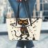 cat dances with the skeleton king with guitar trumpet Leather Tote Bag
