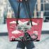 Cat on a dreamy cloud leather tote bag