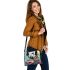 Colorful butterfly perched on vibrant flowers shoulder handbag