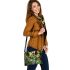Colorful cartoon frogs hanging from tree branches in the jungle shoulder handbag