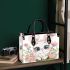 Cute cartoon bunny with big eyes sitting on the flowers small handbag