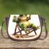 Cute cartoon frog sitting in the sun on an outdoor chair saddle bag