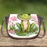 Cute cartoon frog sitting on the ground with pink flowers saddle bag