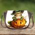 Cute cartoon frog wearing a witch hat sitting on a pumpkin saddle bag