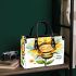 Cute cartoon style bee holding a sunflower small handbag