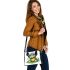 Cute cartoon turtle sitting on a lily pad shoulder handbag