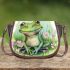 Cute frog sitting on the grass with flowers saddle bag