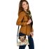 Cute golden retriever with easter eggs and white daisies shoulder handbag