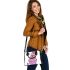 Cute yorkshire terrier dog in a cupcake shoulder handbag