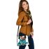 Cute yorkshire terrier wrapped in teal blanket shoulder handbag