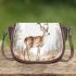 Deer with antlers stands in the forest saddle bag