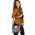 Elegant deer standing amidst autumn foliage shoulder handbag