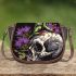 Green frog sitting on top of an skull with purple thistles growing saddle bag