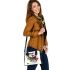 Incorporating geometric shapes and contrasting colors shoulder handbag