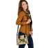 Lines to create patterns around parrot itself shoulder handbag