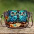 Owls in teal blue and turquoise colors saddle bag