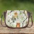 Pattern of owls perched on tree branches saddle bag