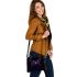 Purple frog with bright green eyes and on a solid shoulder handbag