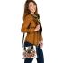 Queen bee sitting on top of honeycomb shoulder handbag