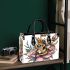 Queen bee with a crown sitting on flower small handbag
