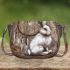 rabbit with dream catcher Saddle Bag