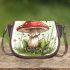 Red and white mushroom with green frog sitting on it saddle bag