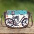 skeleton riding bike with trumpet and music notes Saddle Bag