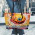 Smiling yellow sphere in whimsical environment leather tote bag