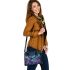 The purple butterflies dance gracefully in the sky shoulder handbag