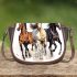 Three horses galloping in the wind saddle bag