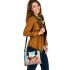 Two cute owls sitting on flowers with colorful butterflies shoulder handbag