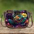 Vibrant teal frog with large eyes sits on top of colorful flowers saddle bag