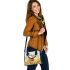 Whitetailed buck standing in a meadow with daisies shoulder handbag