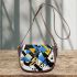 Abstract graffiti shapes in blue saddle bag