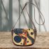 Abstract illustration of an outstretched hand saddle bag