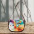 Abstract painting of colorful shapes and circles saddle bag