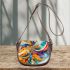 Abstract painting of colorful shapes and circles saddle bag