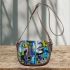 Abstract watercolor painting of surreal shapes and patterns saddle bag