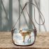 Adorable fawn standing in the snow saddle bag
