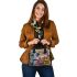 An intricate colorful painting shoulder handbag