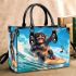 Baby monkey surfs with guitar and musical notes small handbag