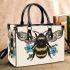 Bee with a blue flower on its back small handbag