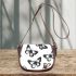 Black and white butterfly pattern with pink accents saddle bag