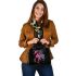 Black background with a colorful horse shoulder handbag