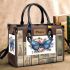 Blue butterfly surrounded by roses and flowers small handbag