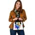 Blue macaw in the style of abstract watercolor shoulder handbag