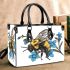 Bumblebee holding a blue forgetmenot flower small handbag