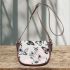 Butterflies and butterfly patterns in soft pink saddle bag