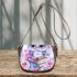 Cartoon owl with big eyes sitting on books surrounded by pink roses saddle bag