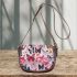 Colorful butterflies on a white saddle bag